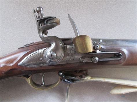 Barrel is original and proof marked, condition overall is very good, good full working action (mainspring is a little soft). . Pedersoli brown bess used